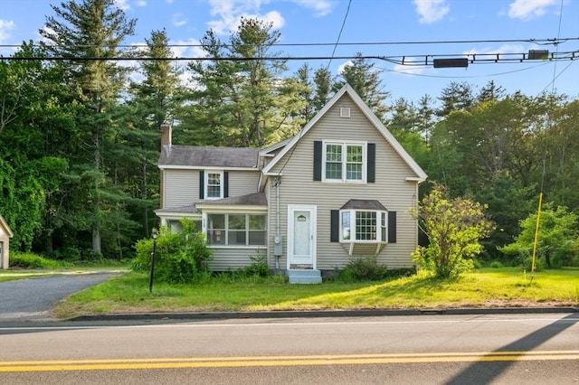 628 Rindge Rd, Fitchburg, MA 01420 - traditional-style home featuring a chimney, entry steps, and a front yard