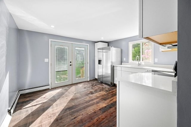 628 Rindge Rd, Fitchburg, MA 01420 - kitchen with stainless steel fridge, stove, a sink, white cabinetry, and recessed lighting