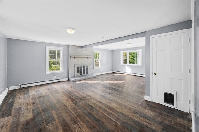 628 Rindge Rd, Fitchburg, MA 01420 - unfurnished living room featuring a fireplace, a baseboard heating unit, baseboards, and dark wood-style flooring