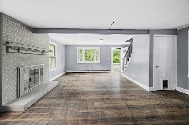 628 Rindge Rd, Fitchburg, MA 01420 - unfurnished living room with a baseboard radiator, stairway, a brick fireplace, and baseboards