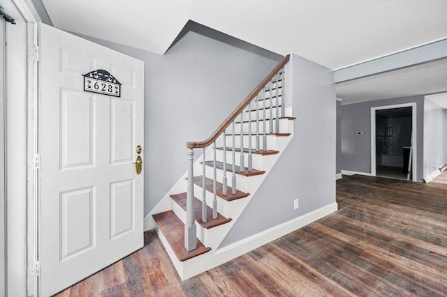 628 Rindge Rd, Fitchburg, MA 01420 - stairs featuring wood finished floors and baseboards