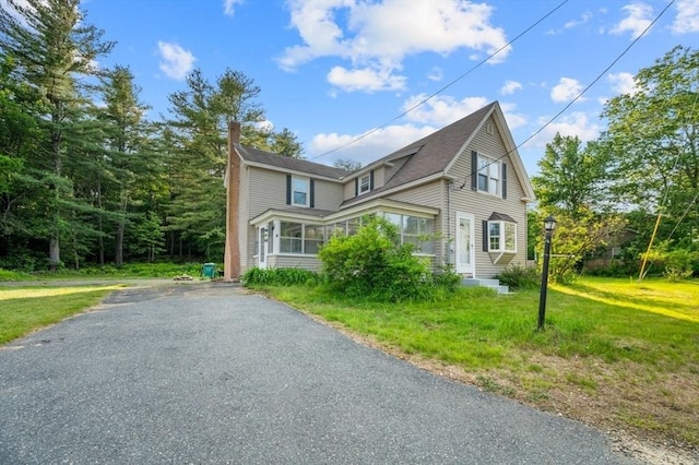 628 Rindge Rd, Fitchburg, MA 01420 - view of front of property featuring a chimney and a front yard