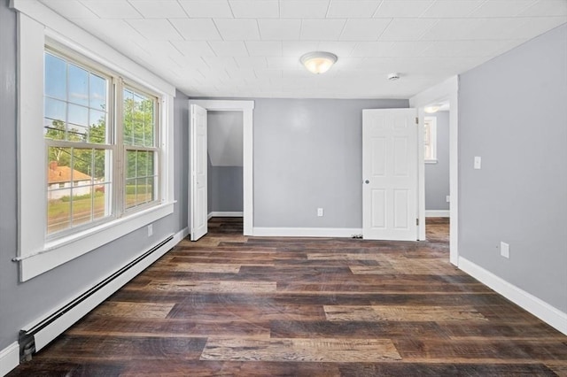 628 Rindge Rd, Fitchburg, MA 01420 - unfurnished room with a baseboard radiator, dark wood-style floors, and baseboards
