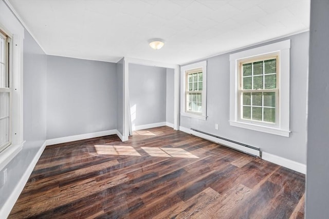 628 Rindge Rd, Fitchburg, MA 01420 - spare room featuring baseboard heating, wood finished floors, and baseboards