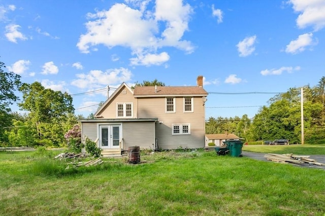 628 Rindge Rd, Fitchburg, MA 01420 - rear view of house featuring french doors, a chimney, a lawn, and entry steps