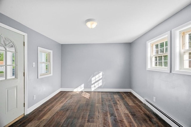 628 Rindge Rd, Fitchburg, MA 01420 - foyer entrance with a baseboard radiator, wood finished floors, and baseboards