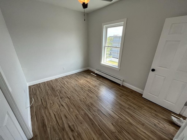 110 Old Harbor St, Boston, MA 02127 - unfurnished room featuring baseboard heating, dark wood-style floors, baseboards, and a ceiling fan