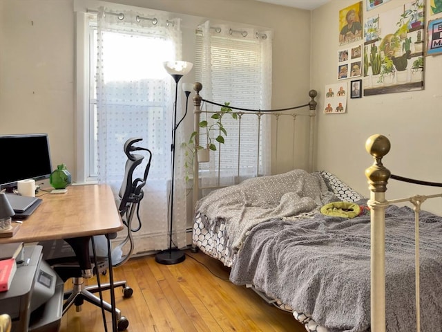 bedroom featuring light wood-style flooring