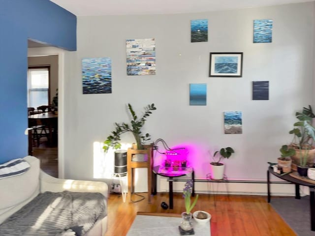 interior space with baseboards and wood finished floors