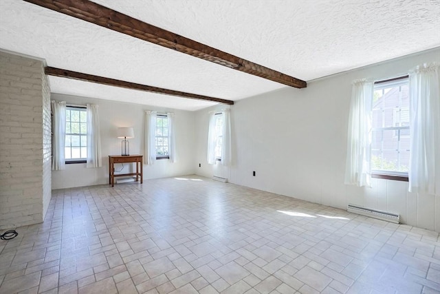 spare room featuring a baseboard radiator, beamed ceiling, brick patterned floor, and a textured ceiling