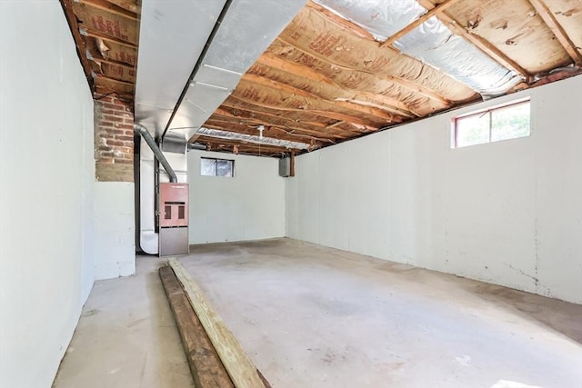below grade area featuring heating unit