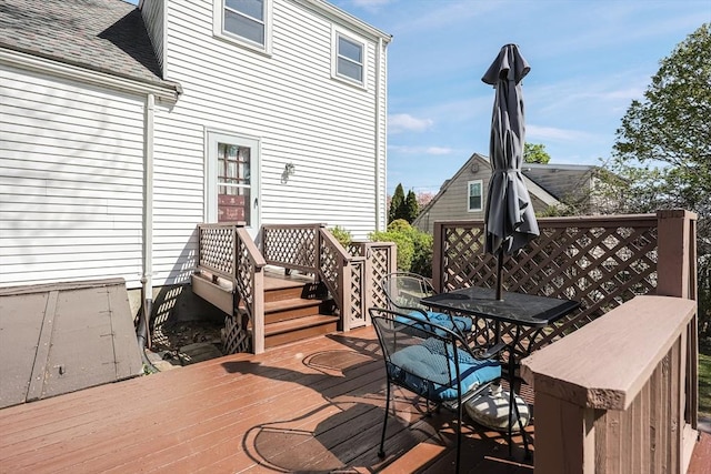 wooden terrace with outdoor dining area