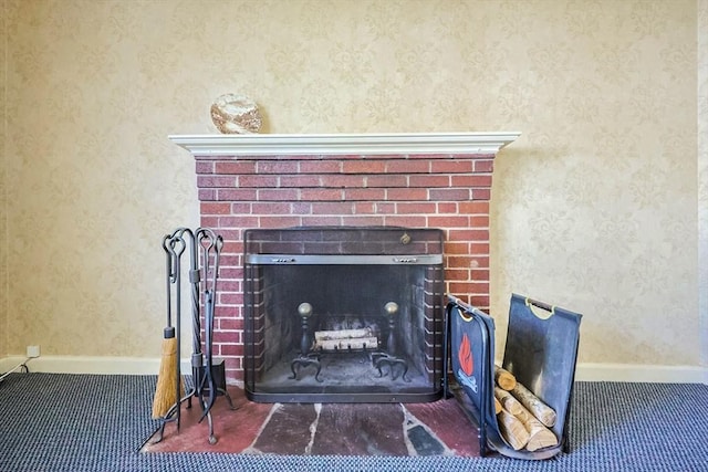 room details with baseboards, a fireplace, carpet flooring, and wallpapered walls