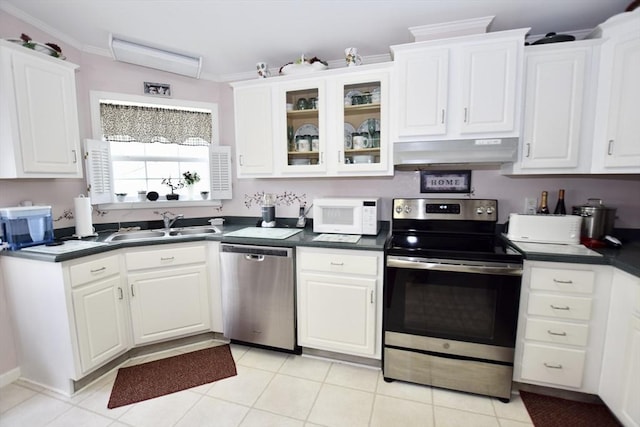 kitchen featuring a sink, white cabinets, stainless steel appliances, and under cabinet range hood