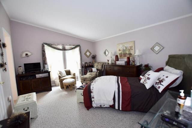 bedroom featuring lofted ceiling, crown molding, and carpet flooring