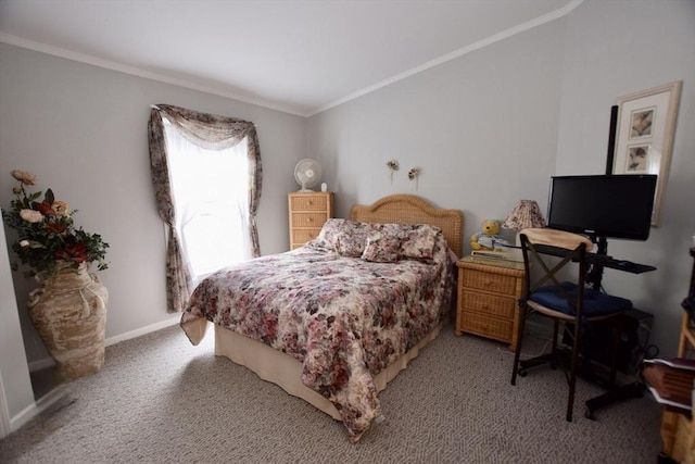 bedroom with carpet floors, crown molding, and baseboards