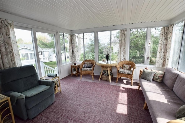 sunroom with an outdoor living space