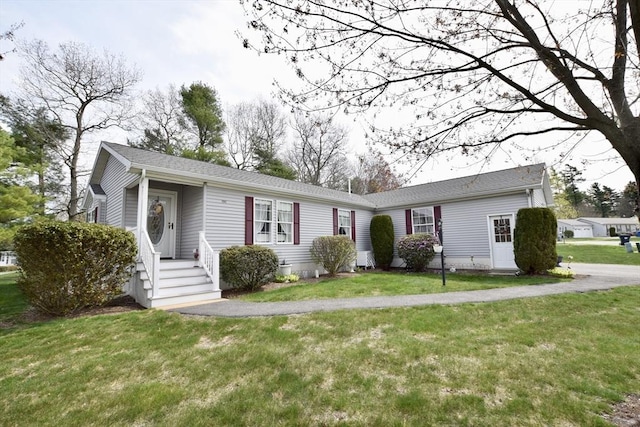 ranch-style house with a front lawn