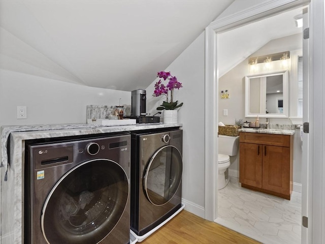 6 Nelly St Unit 3, Wakefield, MA 01880 - laundry area featuring separate washer and dryer and baseboards