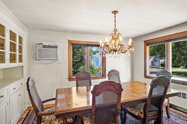 4 Merrow Ln, Stoneham, MA 02180 - dining area with a chandelier, healthy amount of natural light, a wall mounted AC, crown molding, and light wood finished floors