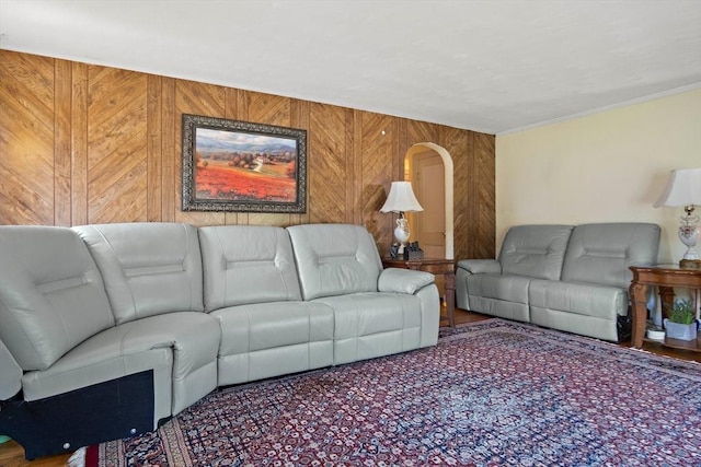 4 Merrow Ln, Stoneham, MA 02180 - living area with arched walkways, wooden walls, and crown molding