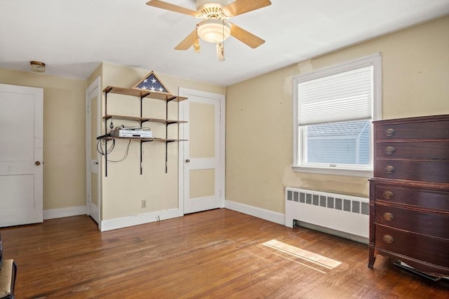 4 Merrow Ln, Stoneham, MA 02180 - empty room featuring radiator heating unit, wood finished floors, and baseboards