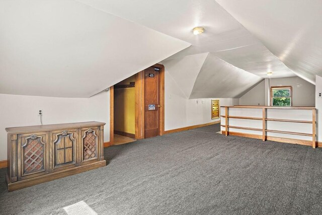4 Merrow Ln, Stoneham, MA 02180 - additional living space with carpet floors, vaulted ceiling, and baseboards
