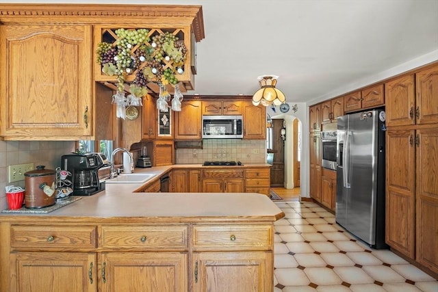 4 Merrow Ln, Stoneham, MA 02180 - kitchen with black appliances, a sink, light floors, light countertops, and backsplash