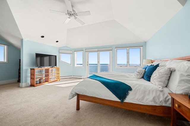 carpeted bedroom with multiple windows, access to exterior, vaulted ceiling, and ceiling fan