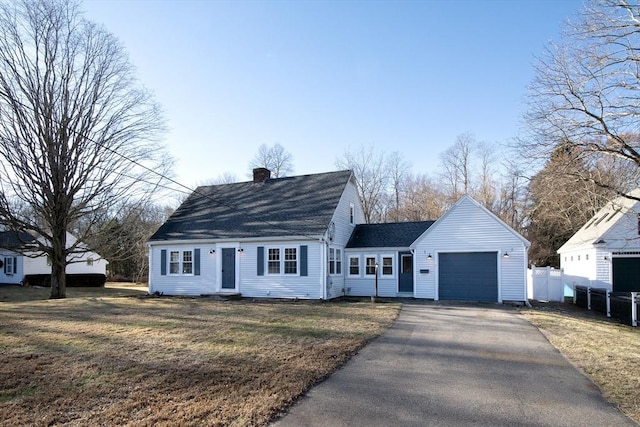 view of front of home featuring a garage and a front lawn