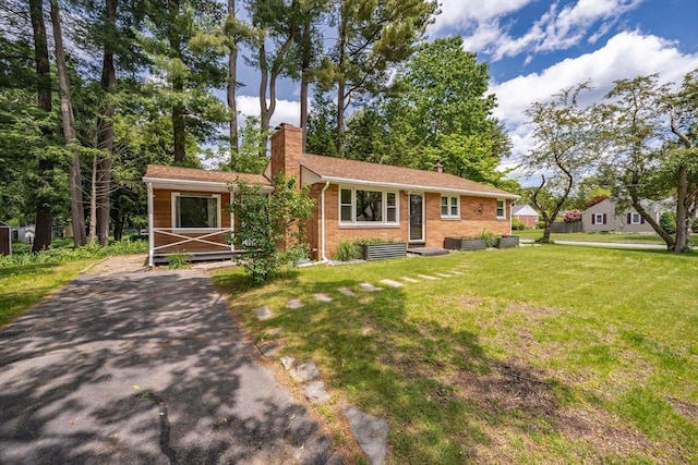 226 Dutchess St, Springfield, MA 01129 - single story home featuring a chimney, brick siding, and a front lawn