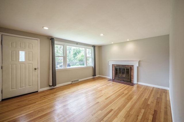 226 Dutchess St, Springfield, MA 01129 - unfurnished living room featuring light wood-style flooring, a fireplace, baseboards, and recessed lighting