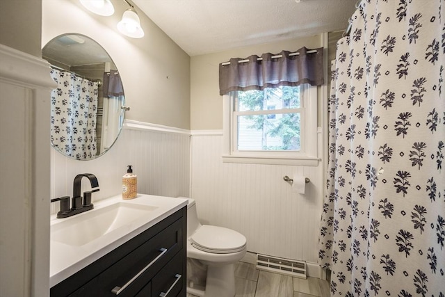 226 Dutchess St, Springfield, MA 01129 - bathroom featuring toilet, vanity, a wainscoted wall, and a shower with curtain