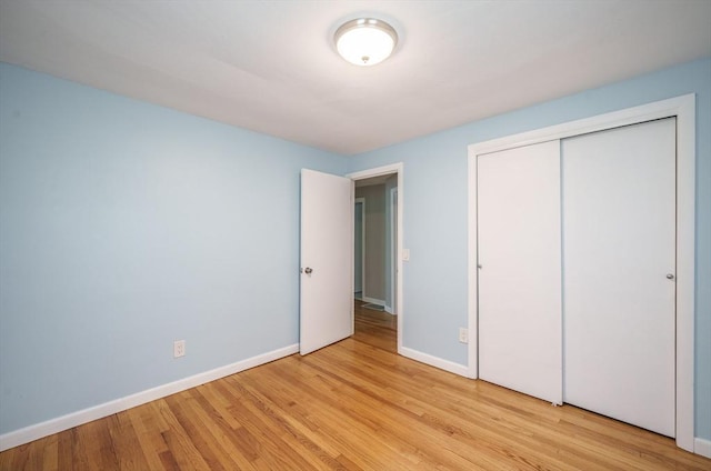 226 Dutchess St, Springfield, MA 01129 - unfurnished bedroom with light wood-style floors, baseboards, and a closet