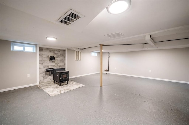 226 Dutchess St, Springfield, MA 01129 - below grade area with a wood stove and baseboards