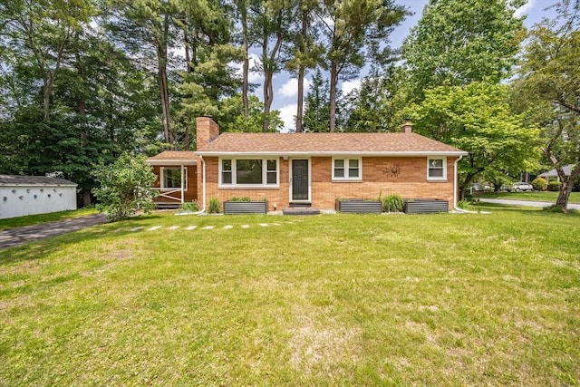 226 Dutchess St, Springfield, MA 01129 - ranch-style home with a chimney, a front lawn, and brick siding