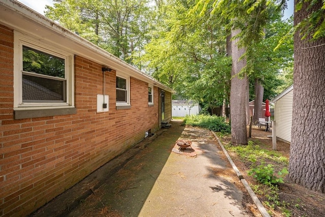 226 Dutchess St, Springfield, MA 01129 - view of home's exterior with brick siding and a patio area