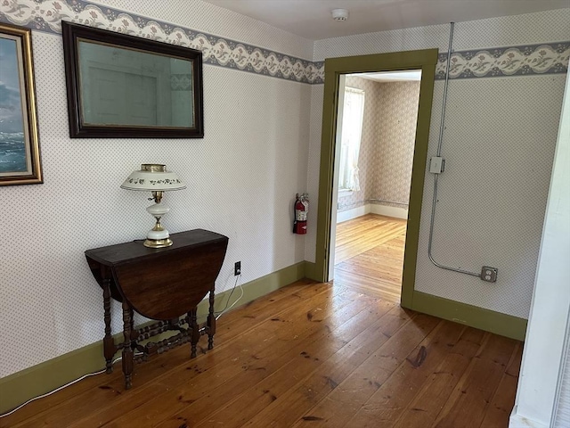 6 Weaver Farm Rd, Rutland, MA 01543 - hallway with wallpapered walls and dark wood-style floors