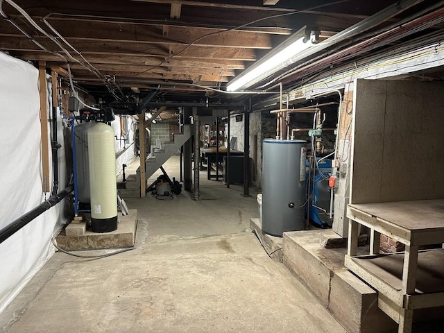 6 Weaver Farm Rd, Rutland, MA 01543 - unfinished basement with water heater, stairs, and a water softener system