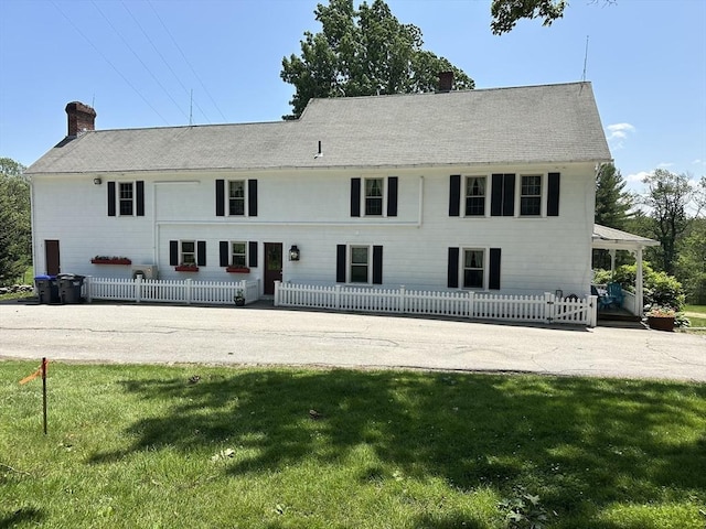 6 Weaver Farm Rd, Rutland, MA 01543 - back of property with a chimney and a fenced front yard