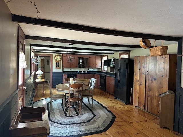 6 Weaver Farm Rd, Rutland, MA 01543 - dining area with light wood finished floors, beamed ceiling, and a textured ceiling