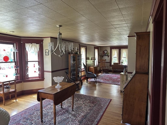 6 Weaver Farm Rd, Rutland, MA 01543 - dining area featuring hardwood / wood-style floors, a chandelier, and ornamental molding