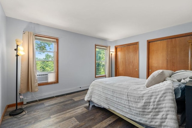 43 Outlook Rd, Billerica, MA 01862 - bedroom with dark wood finished floors, baseboard heating, multiple closets, and cooling unit