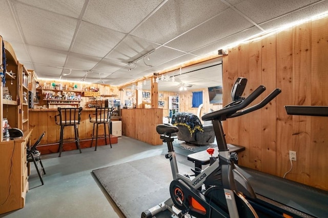 43 Outlook Rd, Billerica, MA 01862 - workout area with a paneled ceiling, wood walls, a bar, and a ceiling fan