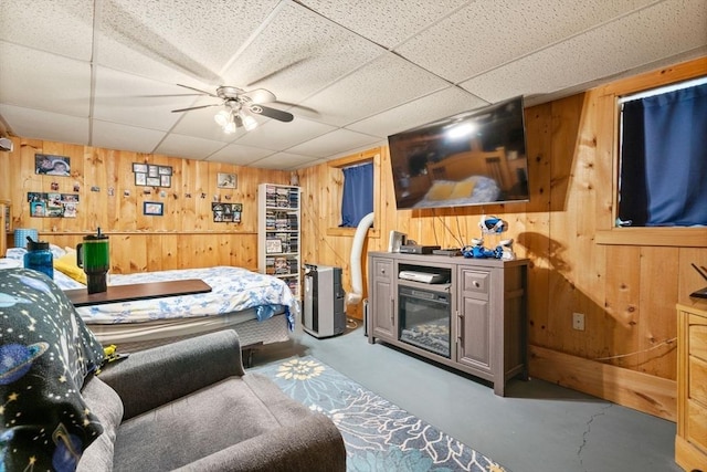 43 Outlook Rd, Billerica, MA 01862 - living area featuring wood walls, finished concrete floors, and a paneled ceiling