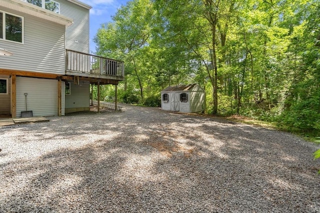 43 Outlook Rd, Billerica, MA 01862 - view of yard with a storage shed, a deck, and driveway