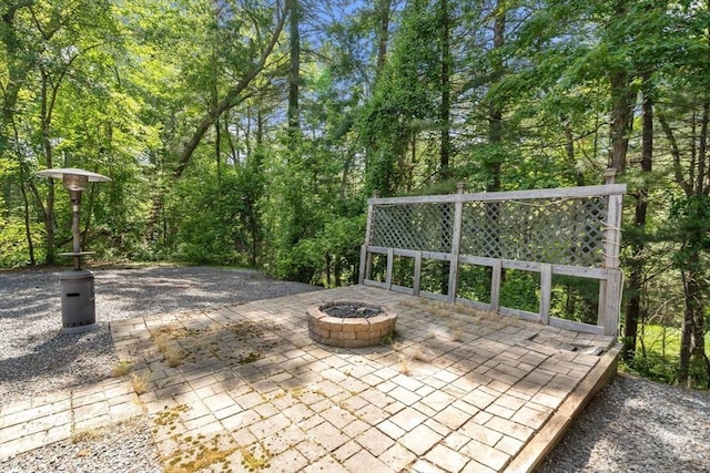 43 Outlook Rd, Billerica, MA 01862 - view of patio featuring a fire pit and a forest view