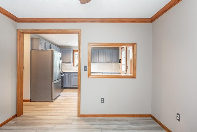 145 Reservoir St, Norton, MA 02766 - kitchen with freestanding refrigerator, gray cabinetry, ornamental molding, baseboards, and light wood finished floors
