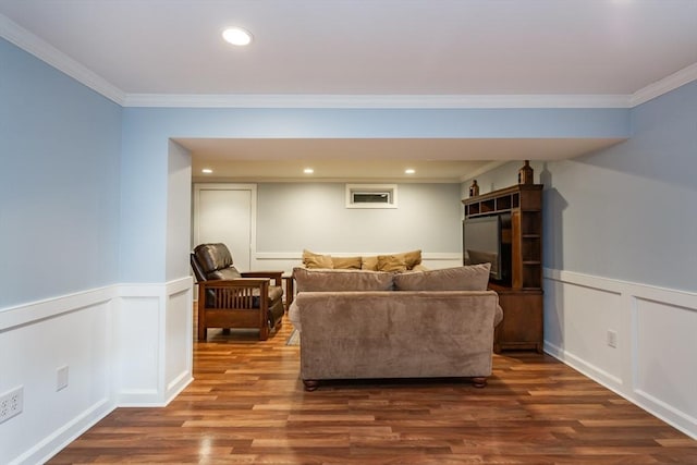 145 Reservoir St, Norton, MA 02766 - living area featuring wood finished floors, ornamental molding, a decorative wall, wainscoting, and recessed lighting