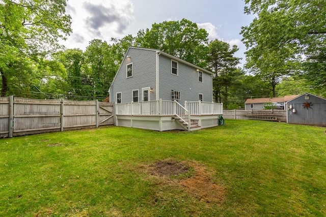145 Reservoir St, Norton, MA 02766 - rear view of house with a wooden deck and view of scattered trees